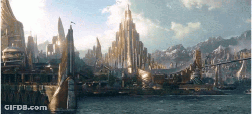 Futuristic City Surrounded By Water And Mountains GIF