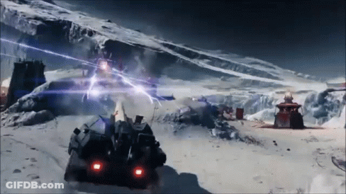 A Futuristic Vehicle Is Driving Through A Snowy Mountain GIF