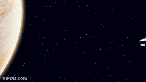 A Futuristic Vehicle Is Flying Through The Air With Smoke Coming Out Of It GIF