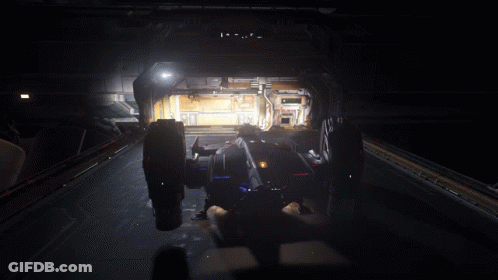 A Futuristic Vehicle Is Parked In A Dark Room With The Number 00 On The Wall GIF