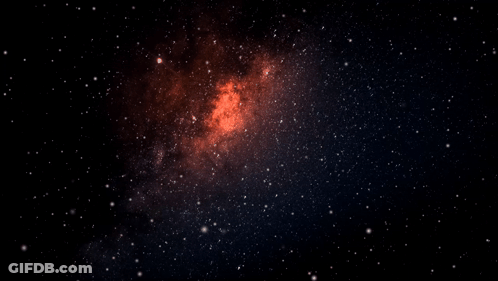A Galaxy In The Night Sky With A Red Center GIF