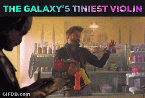 A Galaxy 'S Tiniest Violin Poster With A Man GIF