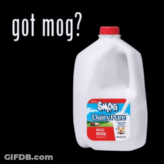 A Gallon Of Smog Dairy Pure Milk Is Sitting On A Black Background GIF