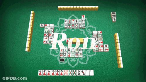 A Game Of Roll Is Being Played On A Green Surface GIF