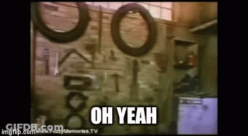A Garage With Tires Hanging On The Wall And The Words Oh Yeah Written On The Bottom GIF