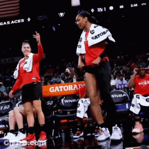 A Gatorade Banner Is Being Held Up By A Basketball Player GIF