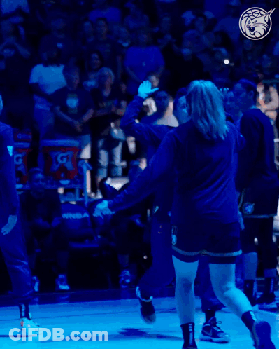 A Gatorade Bucket Sits Behind A Basketball Player On The Court GIF