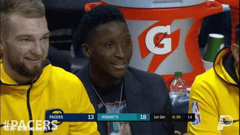 A Gatorade Cooler Is In The Background Of A Basketball Game Between The Pacers And Hornets GIF