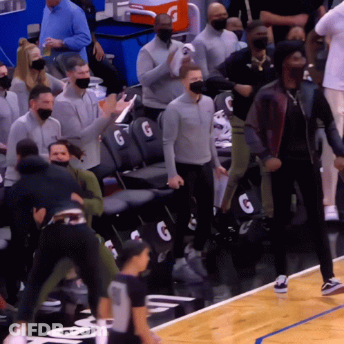 A Gatorade Cooler Sits In The Stands Behind The Basketball Court GIF