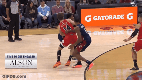 A Gatorade Sign Is Behind A Basketball Player GIF