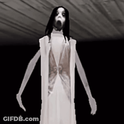 A Ghost In A White Dress Is Standing In The Dark . GIF