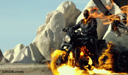 A Ghost Rider Is Riding A Motorcycle In The Desert GIF