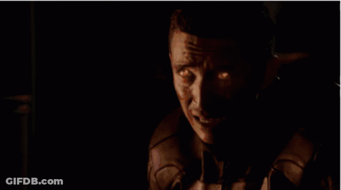 A Ghost Rider With Flames Coming Out Of His Head Is Looking At The Camera . GIF