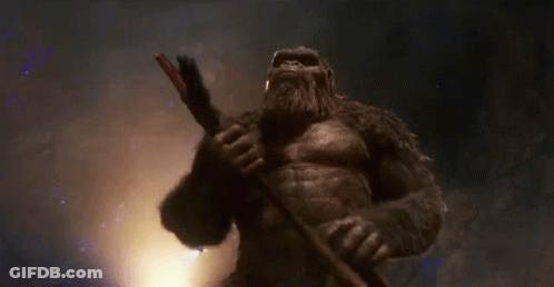 Giant Gorilla Holding Sword In Dark Room GIF