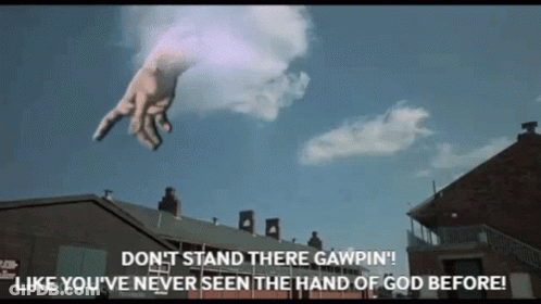 A Giant Hand Is Flying Through The Air With The Words " Don T Stand There Gawpin " GIF
