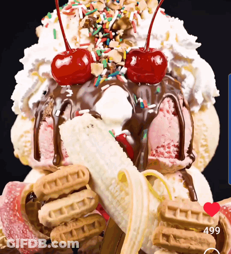 A Giant Ice Cream Sundae With A Banana And Cherry On Top GIF