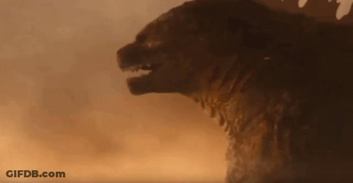 A Giant Monster Is Standing In The Middle Of A Field . GIF