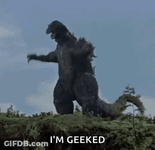 A Giant Monster Is Standing On Top Of A Hill . GIF