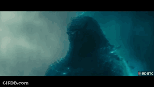 A Giant Monster Is Swimming In The Water In A Movie Scene From The Movie Godzilla King Of The Monsters . GIF
