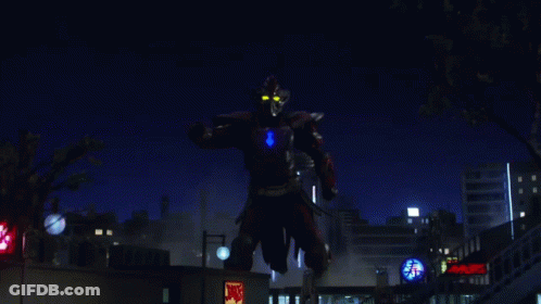 A Giant Robot Is Standing In Front Of A Mcdonald 'S Restaurant GIF