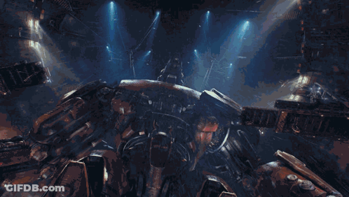 A Giant Robot With The Letter H On It 'S Head GIF