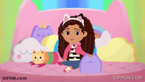 A Gif From Gifrun.com Shows A Girl Sitting On A Bed With A Stuffed Cat GIF