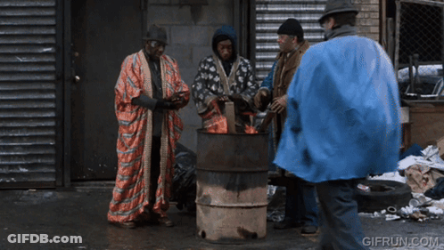 A GIF From Gifrun.com Shows A Man In A Blue Coat Talking To Two Other Men GIF