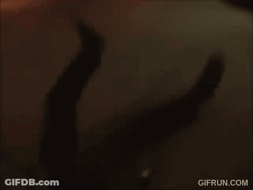 A Gif From Gifrun.com Shows A Person Walking Through A Parking Garage GIF
