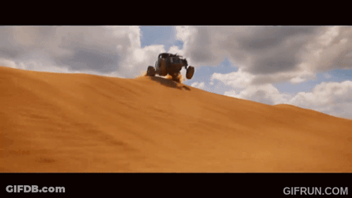 A Gif From Gifrun.com Shows A Vehicle Driving Down A Sandy Hill GIF