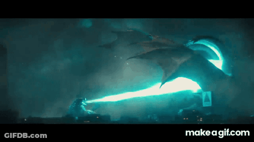 A Gif Of A Dragon Shooting A Beam Of Light At A Monster GIF