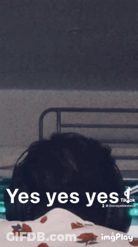 A Gif Of A Person Laying On A Bed With The Words Yes Yes Yes GIF
