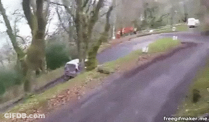 A Gif Of A Person Riding A Bike Down A Road With The Url Freegifmaker.me GIF