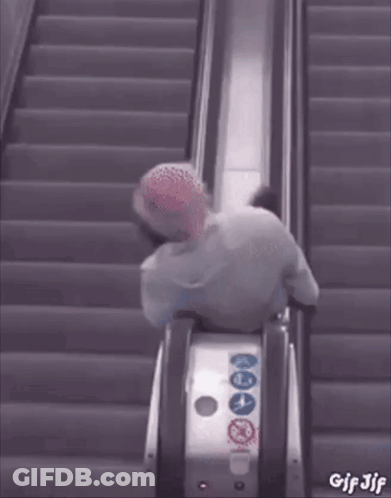 A GIF Of A Person Riding An Escalator With The Words GIF Jjf On The Bottom GIF