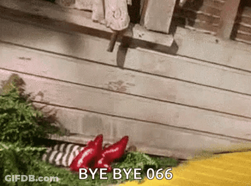 A Gif Of A Person Saying Bye Bye 666 In Front Of A Wooden Building GIF