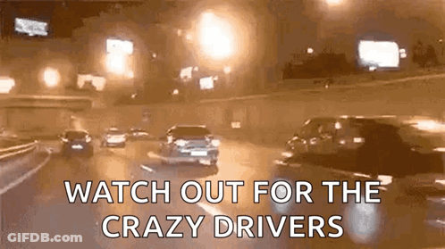 A Gif Of Cars Driving Down A Highway At Night With The Words Watch Out For The Crazy Drivers GIF