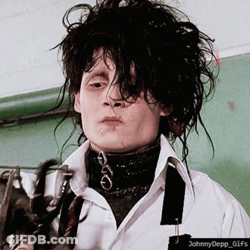 A Gif Of Johnny Depp Holding A Pair Of Scissors With The Caption Johnnydepp GIF