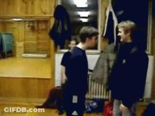 A Gifbin.com Image Of Two Men Standing Next To Each Other In A Room GIF