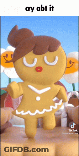 A Gingerbread Girl With A Bun On Her Head Is Dancing GIF