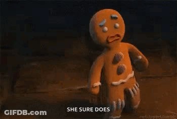 A Gingerbread Man From Shrek Is Holding A Stick In His Hand And Says `` She Sure Does '' . GIF