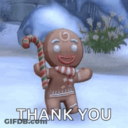 A Gingerbread Man Is Holding A Candy Cane In His Hand And Saying `` Thank You '' . GIF