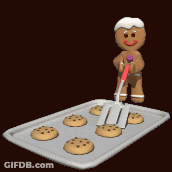 A Gingerbread Man Is Holding A Spatula Over A Baking Sheet Of Cookies GIF