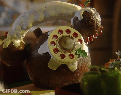 A Gingerbread Telephone With Icing On It GIF