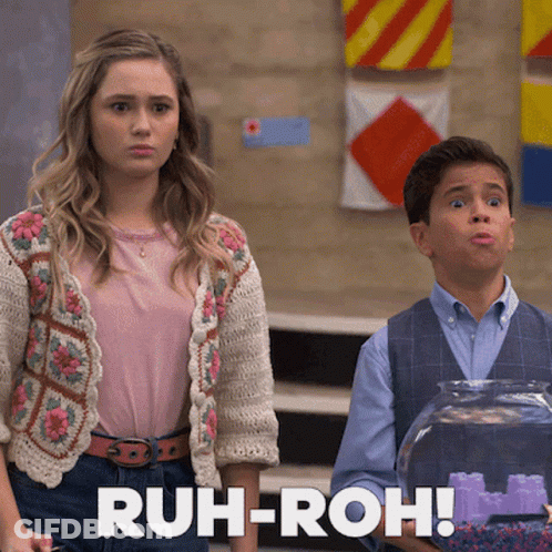 A Girl And A Boy Are Standing Next To Each Other With The Words Ruh-Roh In The Corner GIF
