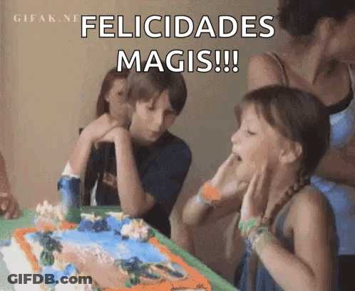 A Girl Blowing Out A Candle On A Birthday Cake GIF
