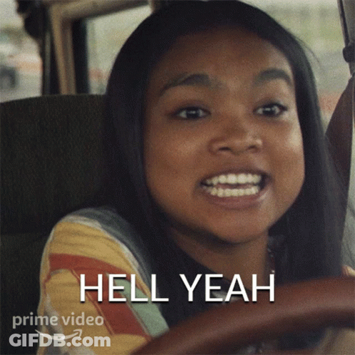 A Girl Driving A Car With The Words Hell Yeah On The Bottom GIF