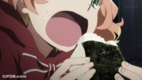 A Girl Eating A Sandwich With Tokyo Mx 1 Written On The Bottom GIF