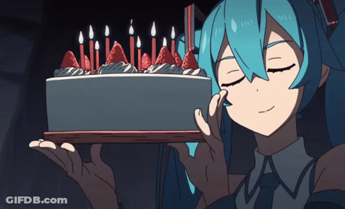 A Girl Holding A Cake With Candles On It GIF