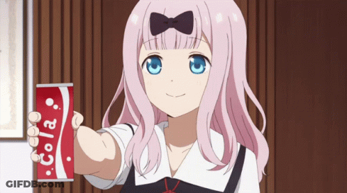 A Girl Holding A Can Of Cola In Her Hand GIF