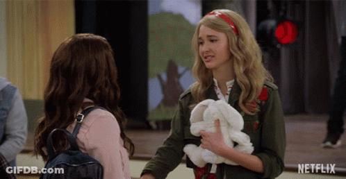Girl Holding Stuffed Rabbit Talking To Another Girl GIF
