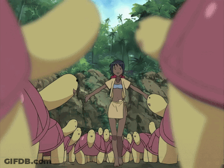 A Girl In A Bikini Is Surrounded By A Bunch Of Turtles GIF